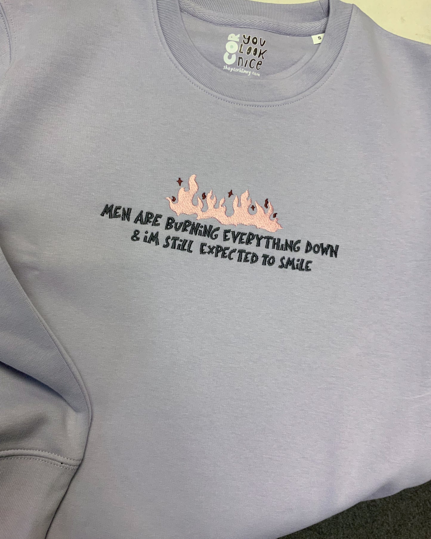 STILL EXPECTED TO SMILE SWEATER