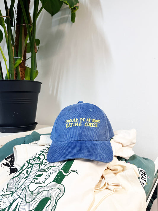 I SHOULD BE AT HOME EATING CHEESE CORD CAP